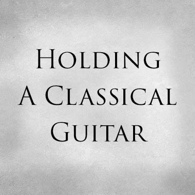 Holding A Classical Guitar